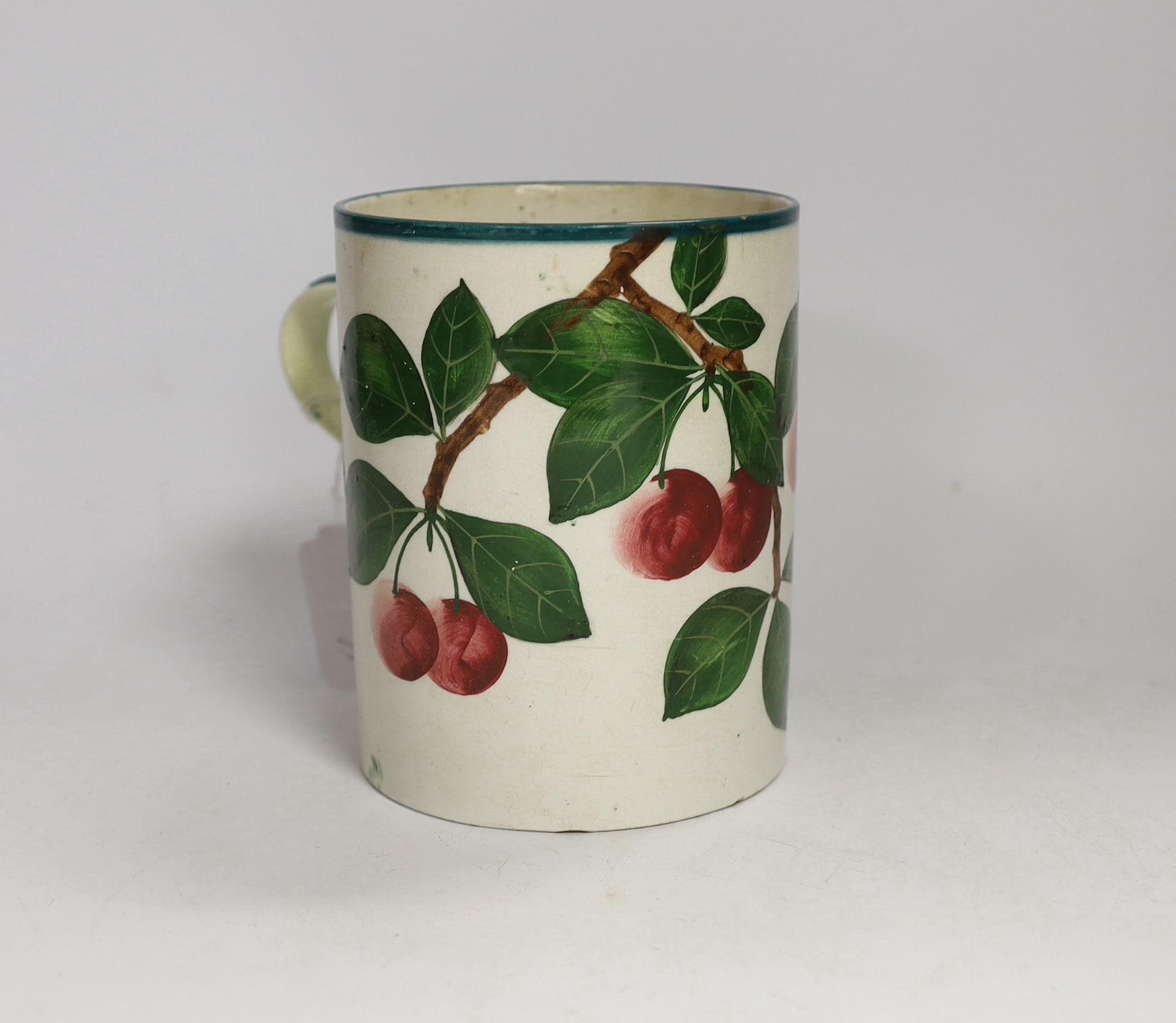 A Wemyss mug with cherry decoration (restored a.f.), 14cm high